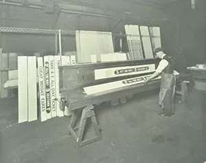 Stencilling Prints: Man stencilling signs for tram cars at Charlton Central Repair Depot, London, 1932