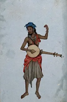 A man wearing a cloth skirt and a turban, playing a musical instrument. Creator: Unknown