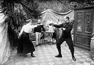 Fencing Prints: Man and woman fencing (?), between c1910 and c1915. Creator: Bain News Service
