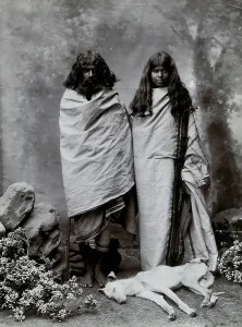 South Asian Prints: A man and woman of the Toda tribe standing in a photographic studio