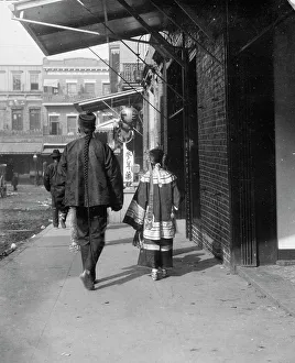 Chinese Americans Prints: Man and a young girl walking down a sidewalk