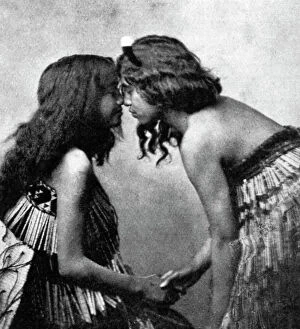 Maori girls rubbing noses, c1920
