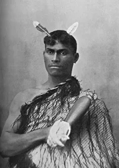A Maori youth carrying the flat greenstone (nephrite) club known as a mere, 1902 A Maori youth carrying the flat greenstone (nephrite) club known as a mere, 1902
