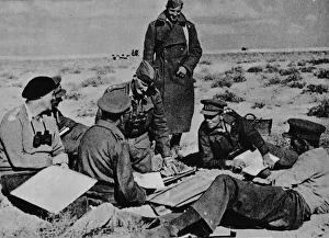 Battle Of El Alamein Gallery: Maps and plans are spread on the sand, 1942 (1944)