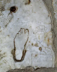 Footprint Prints: Detail of a marble slab, Marble street
