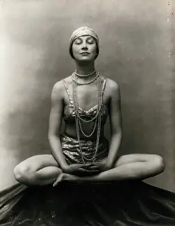 Legs Crossed Prints: Marguerite Agniel posing with her legs crossed and hands together resting on her legs