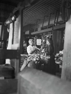 Stall Prints: Market scene, New Orleans, between 1920 and 1926. Creator: Arnold Genthe