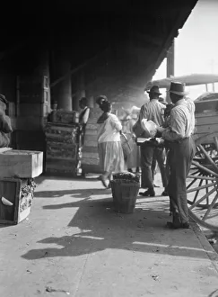 Southern Prints: Market scene, New Orleans, between 1920 and 1926. Creator: Arnold Genthe