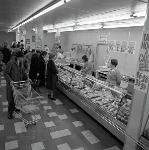 Rotherham Prints: The meat counter at the ASDA supermarket in Rotherham, South Yorkshire, 1969. Artist