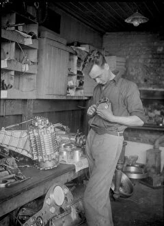Mays Gallery: Mechanic working on Raymond Mays 2996 cc Vauxhall-Villiers. Artist: Bill Brunell