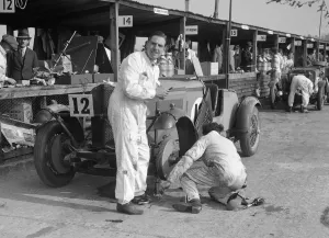 Craig Gallery: Mechanic working on a Talbot 105 at the JCC Double Twelve race, Brooklands, 8 / 9 May 1931