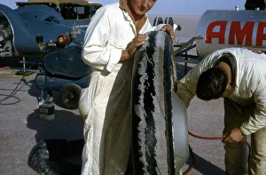 Mechanics inflating Bluebird CN7 tyre for World Land Speed Record attempt, Lake Eyre