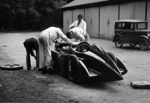 Mechanics working on Leon Cushmans Austin 7 racer for a speed record attempt, Brooklands, 1931
