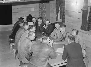 Discussing Gallery: Meeting of the camp council, FSA camp, Farmersville, California, 1939. Creator: Dorothea Lange