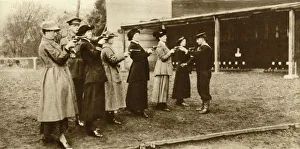 Target Practice Prints: Members of the WRNS at revolver practice, 1915, (1935). Creator: Unknown