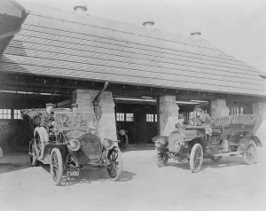 Garage Prints: Four men with two automobiles outside of garage of Edmund Cogswell