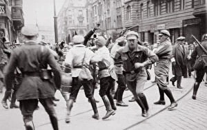 Men in Bolshevik uniform fighting police in the street, Germany, c1918-c1933(?) (1936)
