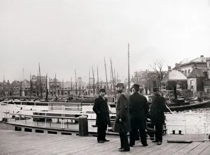 Zuid Holland Prints: Men by a canal boat, Rotterdam, 1898. Artist: James Batkin