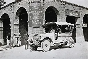 Two men in a car outside the Wellcome pharmaceutical depot in the Middle East, c1900s. Creator: Unknown