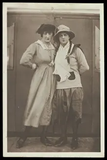 Plait Prints: Two men, both in drag, pose wearing hats and make-up, c1918. Creator: Unknown