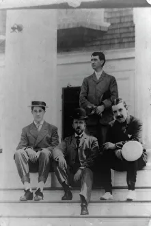 Four men, friends of Frances Benjamin Johnston, posed on porch, between 1900? and 1930. Creator: Frances Benjamin Johnston