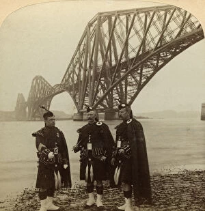 Men in Highland dress in front of the Forth Bridge, Scotland.Artist: Underwood & Underwood