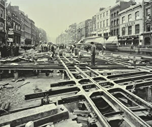 Commercial Road Gallery: Men laying tramlines at a junction, Whitechapel High Street, London, 1929