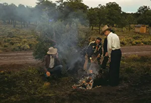 Men in front of outdoor fire, Pie Town Fair, New Mexico, 1940. Creator: Russell Lee