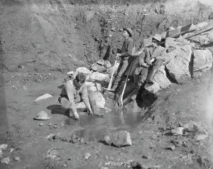 Settlers Prints: Men panning gold, between c1900 and 1927. Creator: Lomen Brothers