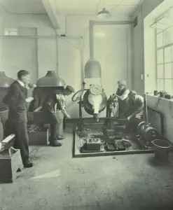 Men pouring molten metal in a foundry, School of Engineering and Navigation, London, 1931