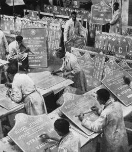 Men in the RAC Highways Department preparing traffic signs, 1935