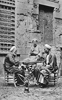 Huqqa Pipe Collection: Men relaxing, Cairo, Egypt, c1922. Artist: Donald McLeish