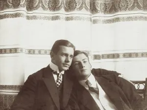 Intimacy Prints: Two men resting close to one another, wearing formal attire, 1910. Creator: Unknown