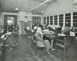Pensioner Gallery: Men sitting in the library at Cedars Lodge old peoples home, Wandsworth, London, 1939