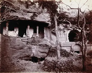 Mumbai Maharashtra India Prints: Two men sitting in a temple carved out of a rock face in Bombay at the time of the plague