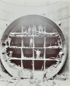 Bermondsey Prints: Men standing in the shield used to cut Rotherhithe Tunnel, Bermondsey, London, July 1907