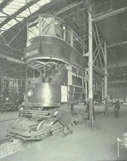 Hoist Prints: Men using a car lifting hoist at Charlton Central Repair Depot, London, 1932