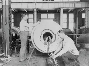 Ordnance Prints: Three men working on large gun in Naval Gun Factory