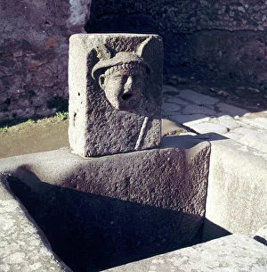 Mercury on a fountain in a street, Pompeii, Italy