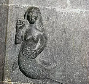Mermaid on the chancel arch of Clonfert Cathedral, 12th century
