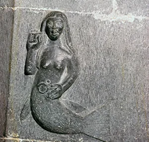 Mermaid on the chancel arch of Clonfert Cathedral, 12th century Mermaid on the chancel arch of Clonfert Cathedral, 12th century