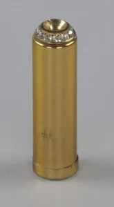 Lipstick Gallery: Metal lipstick holder from Maes Millinery Shop, 1941-1994. Creator: Unknown