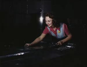 Employee Gallery: Metal parts are placed on masonite by... North American Aviation, Inc. Inglewood, Calif. 1942