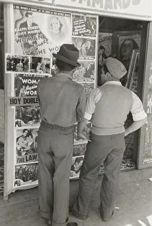 Mexican boys looking at movie poster, San Antonio, Texas, 1939-03. Creator: Russell Lee