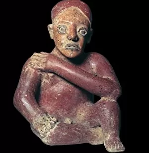 Arm Movement Gallery: Mexican pottery figure of a squatting man, 4th century