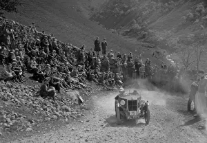 Uphill Climb Prints: MG M type climbing a steep hill during a motoring trial, c1930s. Artist: Bill Brunell