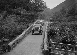 Dartmoor Gallery: MG M type crossing Figle Bridge during a motoring trial, Devon, c1930s. Artist: Bill Brunell