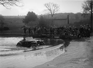 MG PA driving through a ford during a motoring trial, 1936. Artist: Bill Brunell