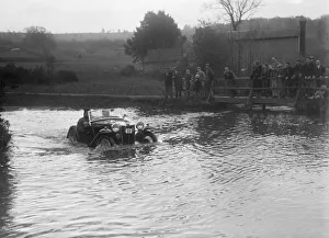 Hazard Prints: MG PA driving through a ford during a motoring trial, 1936. Artist: Bill Brunell