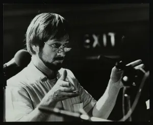 Hertfordshire Gallery: Michael Garrick conducting an orchestra at Berkhamsted Civic Centre, 1985. Artist
